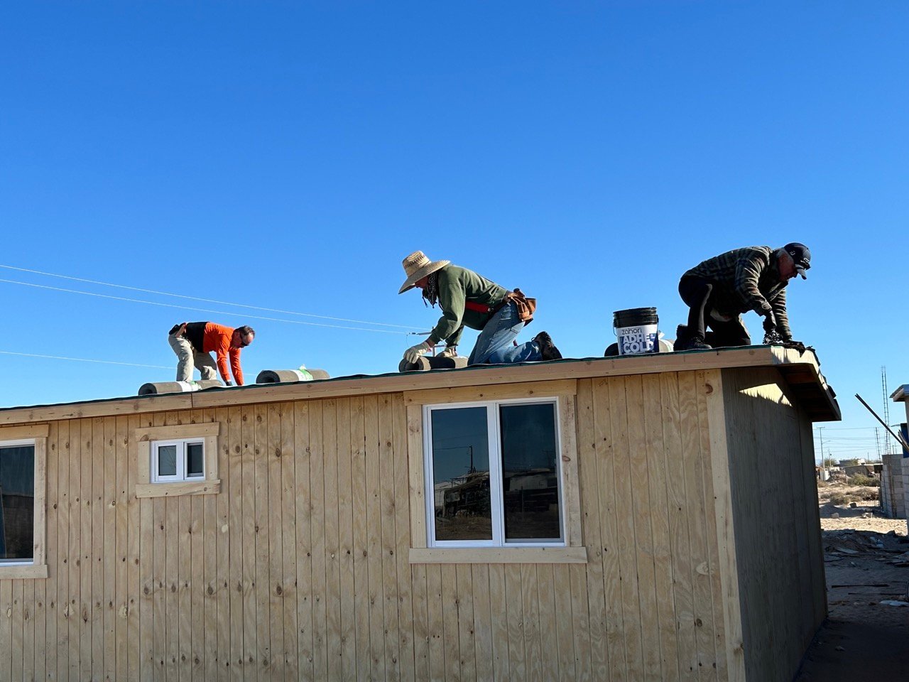 Men working on roof in Puerto Peñasco, Mexico